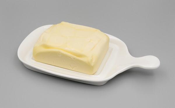 A block of butter on a butter dish