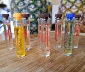 Vials of rum, orange and butter-vanilla baking flavourings
