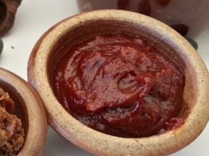 Thick, deep-red gochujang in an earthenware pot