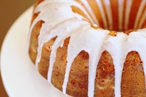 White icing drizzled over a bundt cake