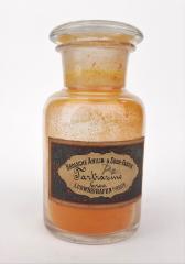 Tartrazine dye powder in an old laboratory bottle