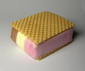 Thin crisp wafers sandwiching a block of Neapolitan ice cream